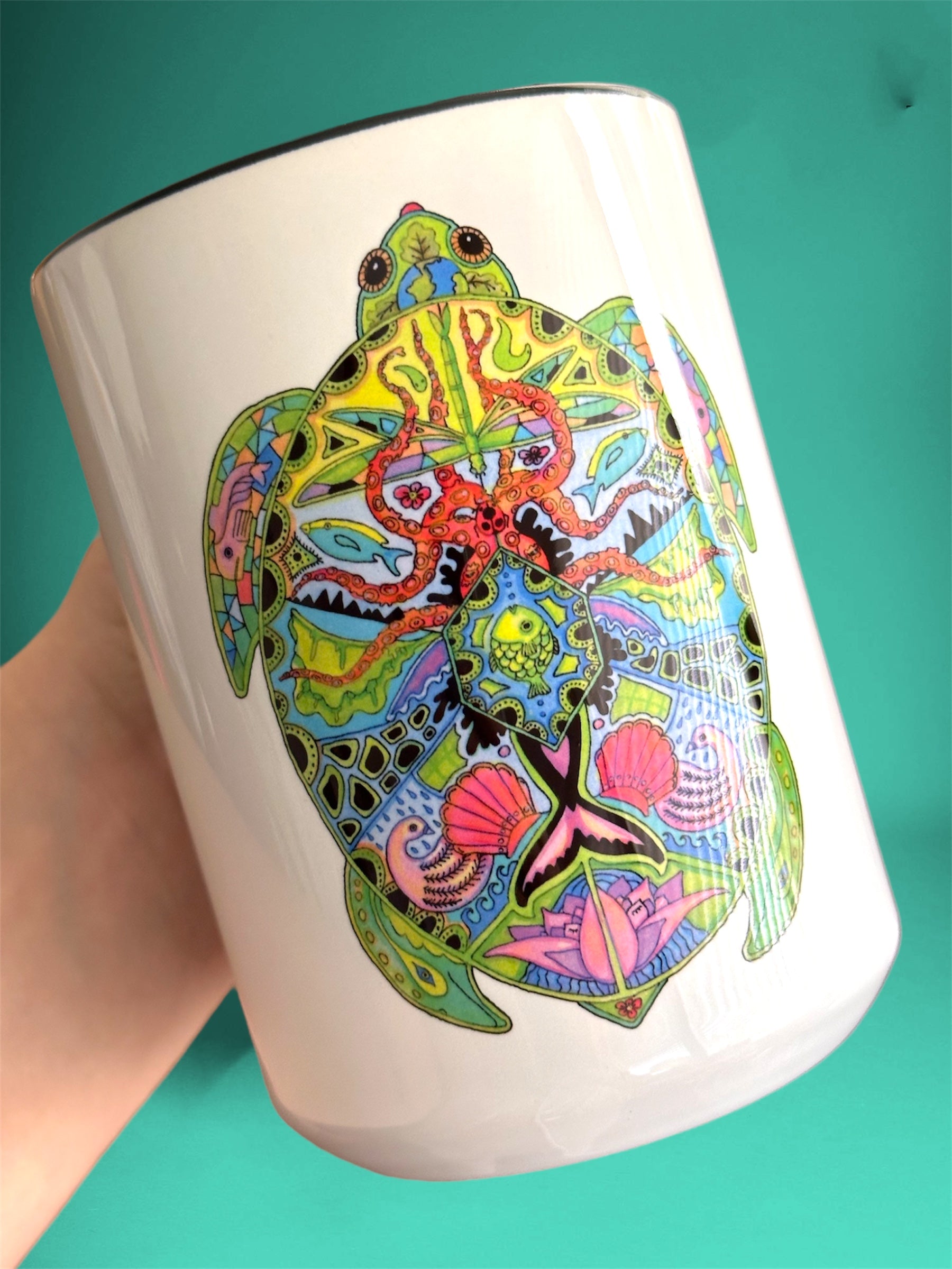 15 oz white ceramic mug with black interior, displaying and image of an animal art with vibrants colors 