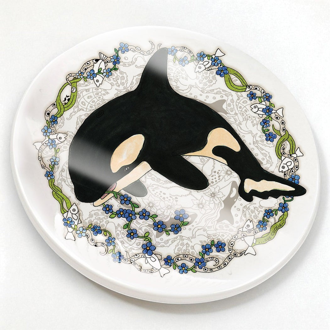 EarthArt International Orca whale ceramic coaster with floral and fish border in black, white, yellow, blue, and green.