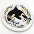 EarthArt International Orca whale ceramic coaster with floral and fish border in black, white, yellow, blue, and green.
